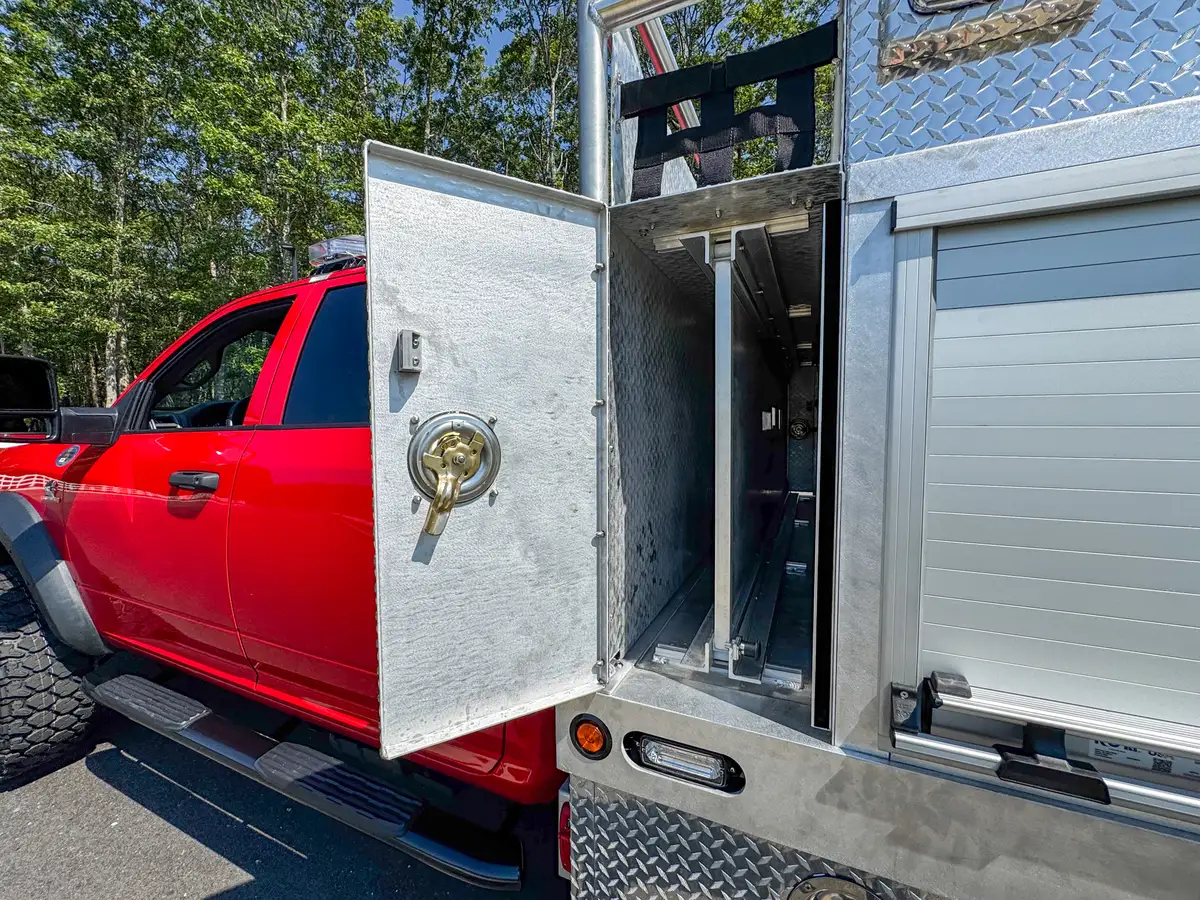 Open long side storage door with full-length shelf bay exposed.